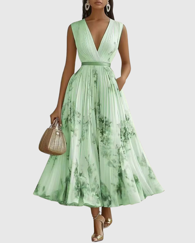 Isabella | Mouwloze geplisseerde dames midijurk met bloemenprint