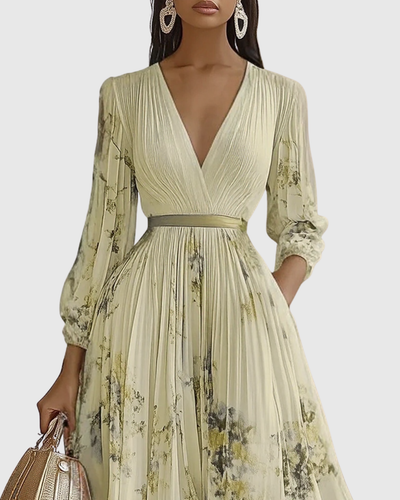 Isabella | Mouwloze geplisseerde dames midijurk met bloemenprint