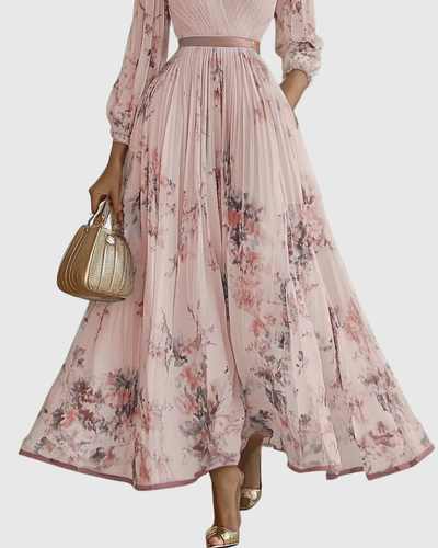 Isabella | Mouwloze geplisseerde dames midijurk met bloemenprint