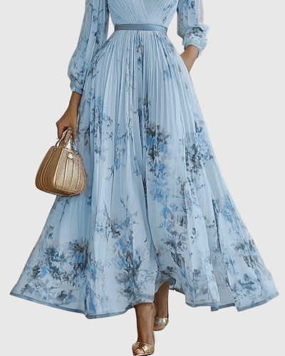 Isabella | Mouwloze geplisseerde dames midijurk met bloemenprint