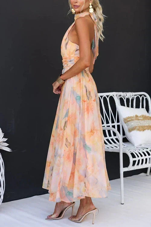 Claudia | Dames zomermaxijurk met halterhals en bloemenprint