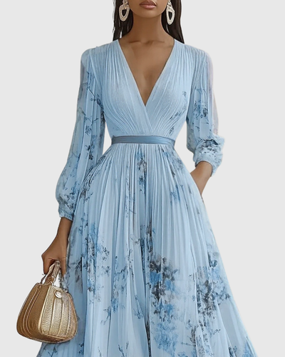 Isabella | Mouwloze geplisseerde dames midijurk met bloemenprint