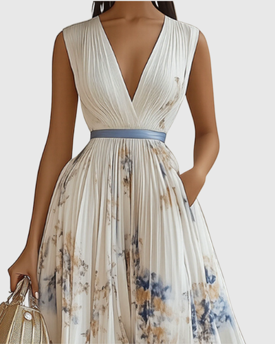Isabella | Mouwloze geplisseerde dames midijurk met bloemenprint