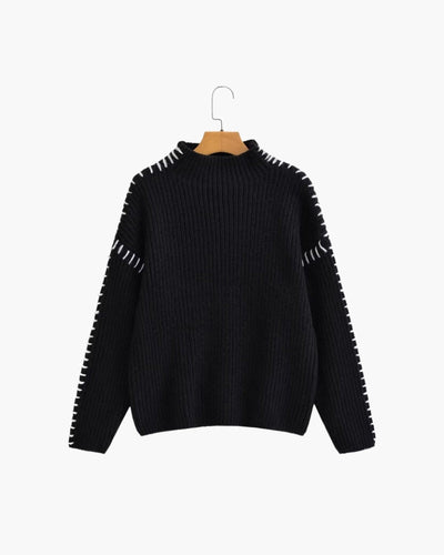 Lila trui met stikdetails