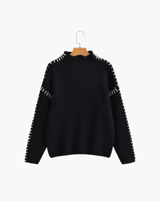 Lila trui met stikdetails