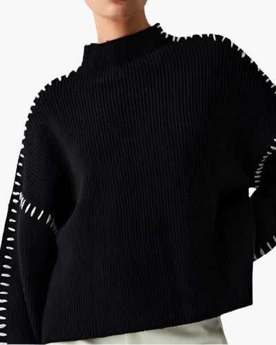 Lila trui met stikdetails