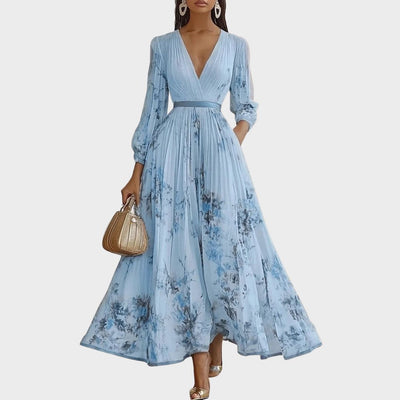 Isabella | Mouwloze geplisseerde dames midijurk met bloemenprint