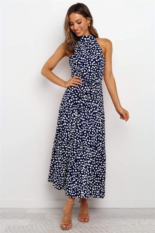 Karin | Dames maxijurk met print, halterhals en taillestrik