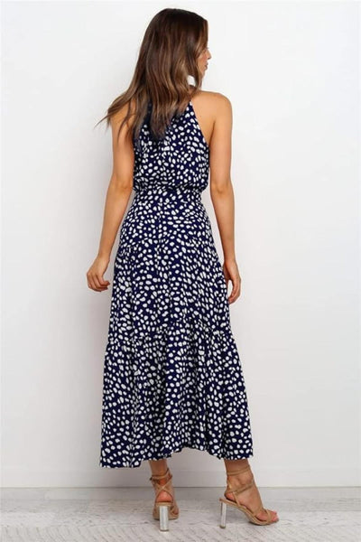 Karin | Dames maxijurk met print, halterhals en taillestrik