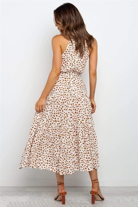 Karin | Dames maxijurk met print, halterhals en taillestrik