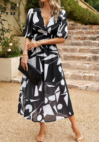 Doris | Dames wikkelmidijurk met abstracte print