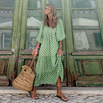 Flora | Boho maxijurk met print, pofmouwen en V-hals