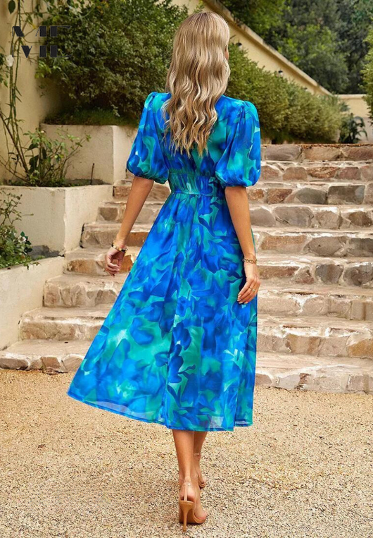 Doris | Dames wikkelmidijurk met abstracte print