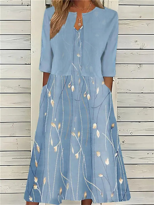 Emilia | Dames midijurk met bloemendessin, ronde hals en zijzakken