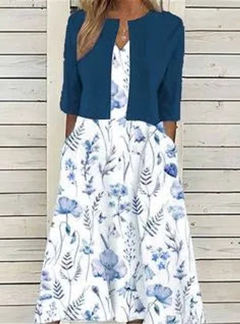Emilia | Dames midijurk met bloemendessin, ronde hals en zijzakken