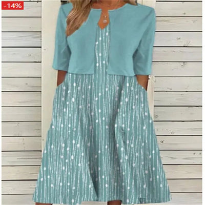 Emilia | Dames midijurk met bloemendessin, ronde hals en zijzakken