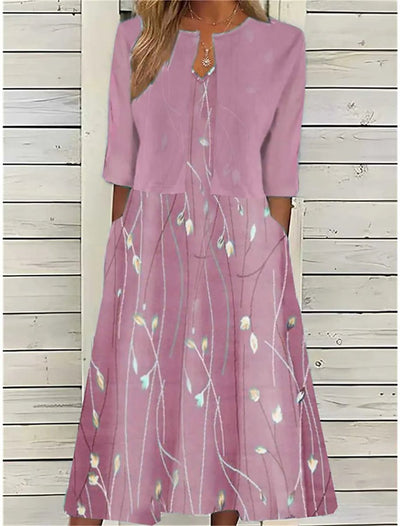 Emilia | Dames midijurk met bloemendessin, ronde hals en zijzakken