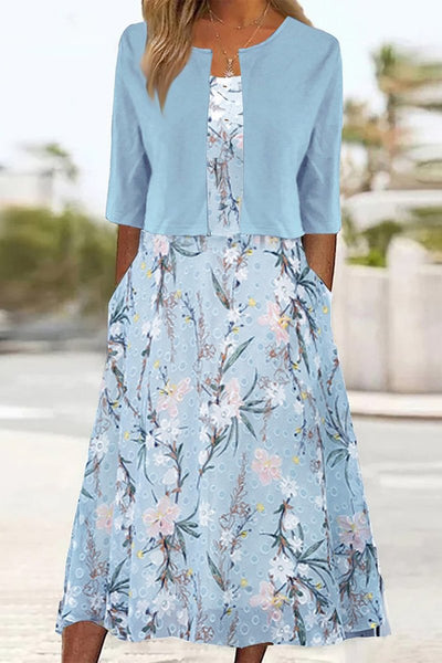 Emilia | Dames midijurk met bloemendessin, ronde hals en zijzakken