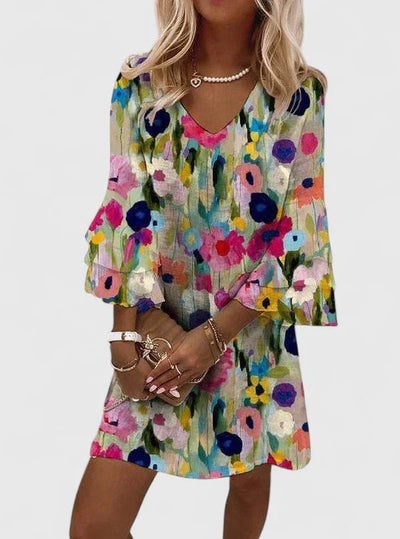 Katharina | Dames minijurk met bloemenprint, V-hals en ruchemouwen