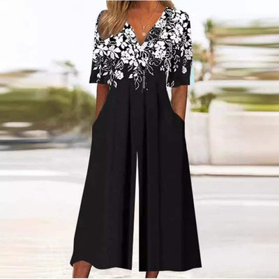 Annika | Dames boho jumpsuit met bloemenmotief, V-hals en halflange mouwen