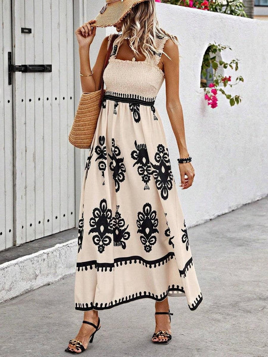 Lena | Mouwloze dames boho maxijurk met gesmokt bovenstuk en bloemenprint