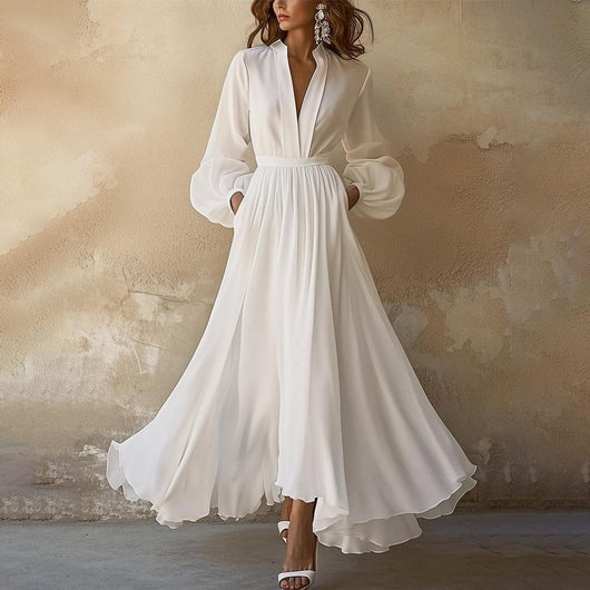 Johanna | Elegante vloeiende dames maxijurk met diepe V-hals en pofmouwen