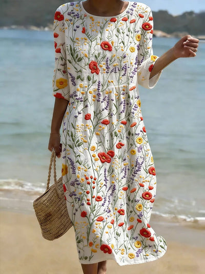 Marie | Losvallende dames midi-maxijurk met bloemenprint en driekwartmouwen