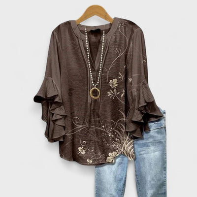 Clara | Lichte dames blouse met bloemenprint, V-hals en ruchemouwen