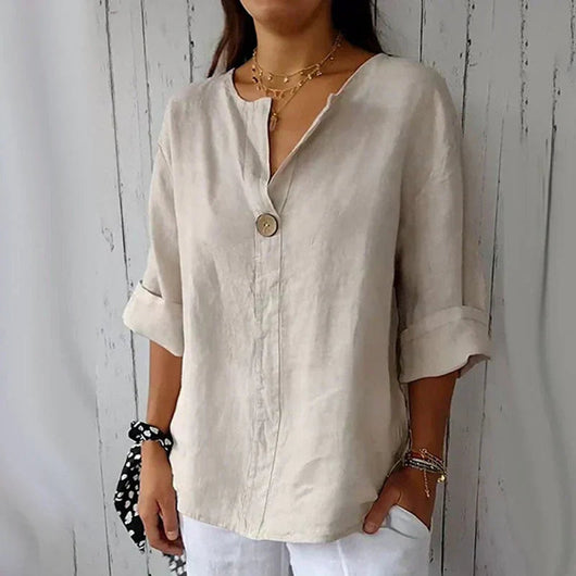 Hannah | Losvallende linnen damesblouse met V-hals, lange mouwen en houten knoop