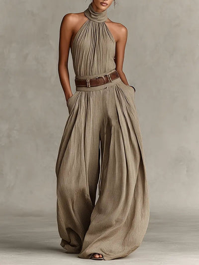 Greta | Mouwloze dames halterneck-jumpsuit met wijde pijp en ceintuur