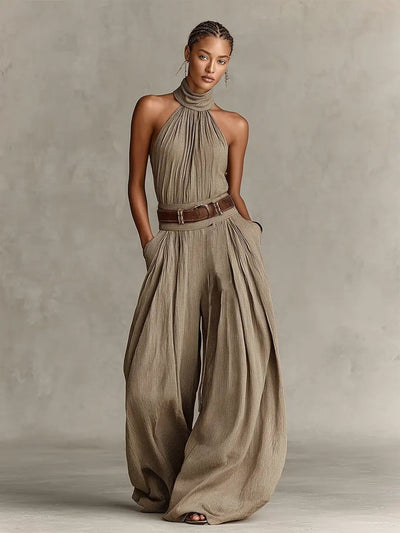 Greta | Mouwloze dames halterneck-jumpsuit met wijde pijp en ceintuur