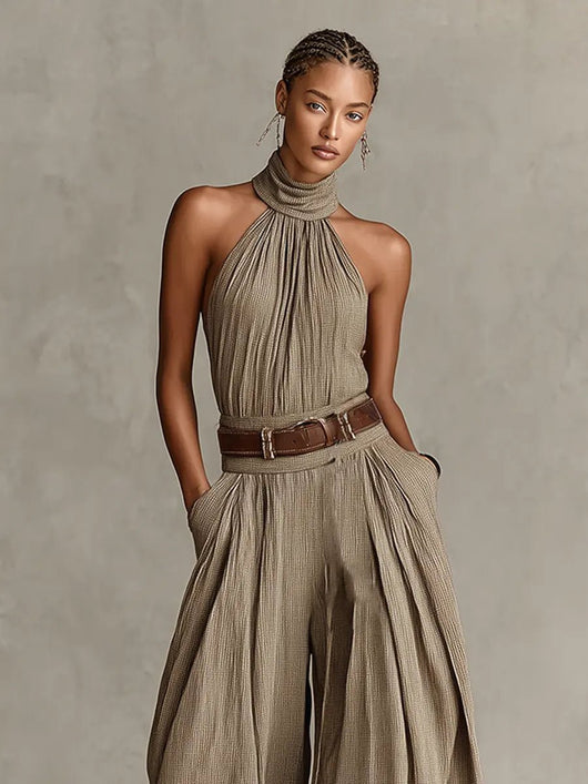 Greta | Mouwloze dames halterneck-jumpsuit met wijde pijp en ceintuur