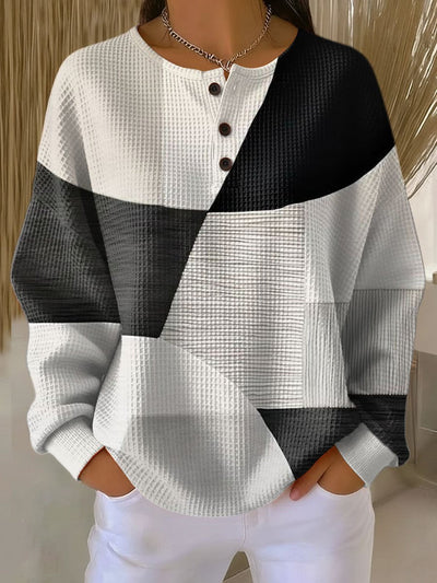Annika | Dames henley trui met relaxed fit, colorblock en wafelstructuur