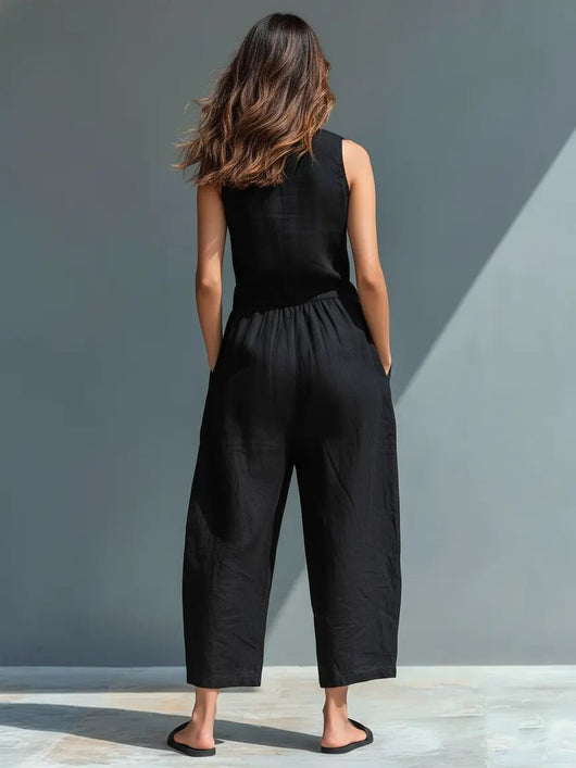 Annika | Mouwloze dames linnen jumpsuit met knoopsluiting en opstaande kraag