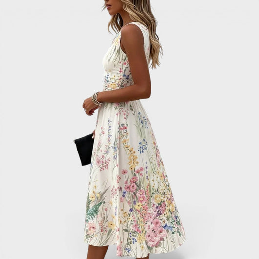 Charlotte | Mouwloze getailleerde dames midi-jurk met bloemendessin in A-lijn