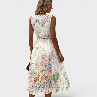 Charlotte | Mouwloze getailleerde dames midi-jurk met bloemendessin in A-lijn
