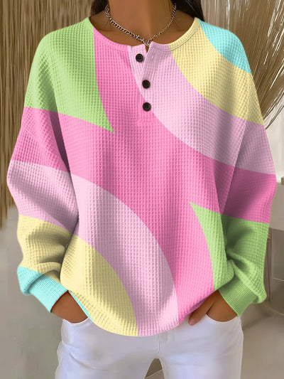 Annika | Dames wafelbrei henleytrui met geometrisch colourblockdessin