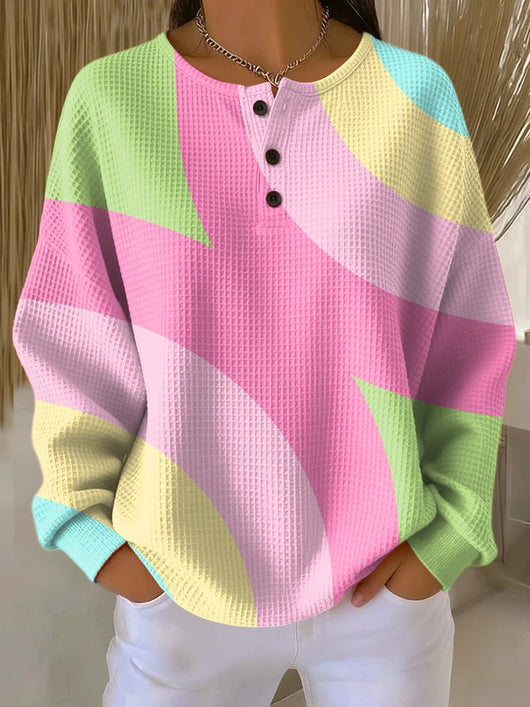 Annika | Dames wafelbrei henleytrui met geometrisch colourblockdessin