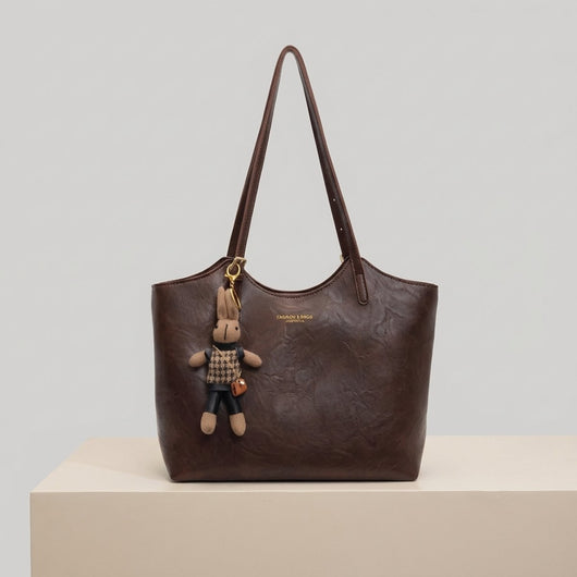 Mia | Dames schoudertas van veganleer met pluche hanger