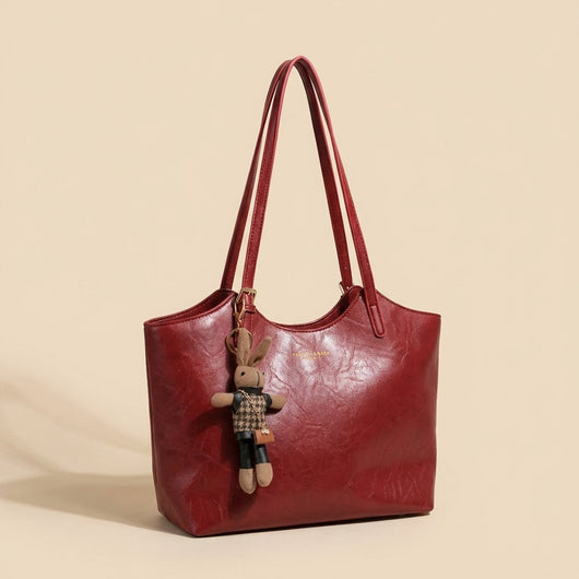 Mia | Dames schoudertas van veganleer met pluche hanger