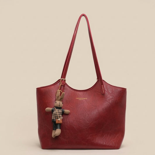 Mia | Dames schoudertas van veganleer met pluche hanger
