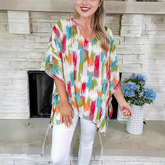 Clara | Wijde oversized dames tuniek met V-hals en kleurrijk verloopdessin