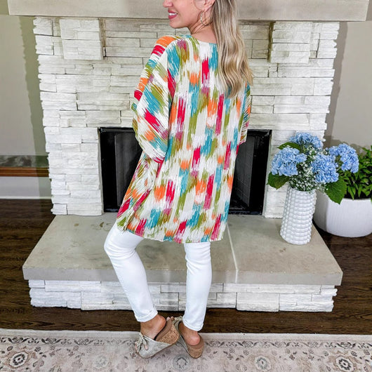 Clara | Wijde oversized dames tuniek met V-hals en kleurrijk verloopdessin